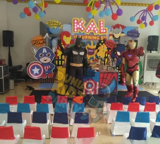 Superhero-themed kids birthday party with costumed characters